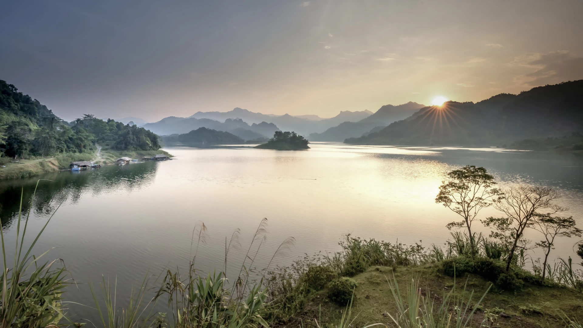 Open water and distant wooded shore on Hòa Bình Lake