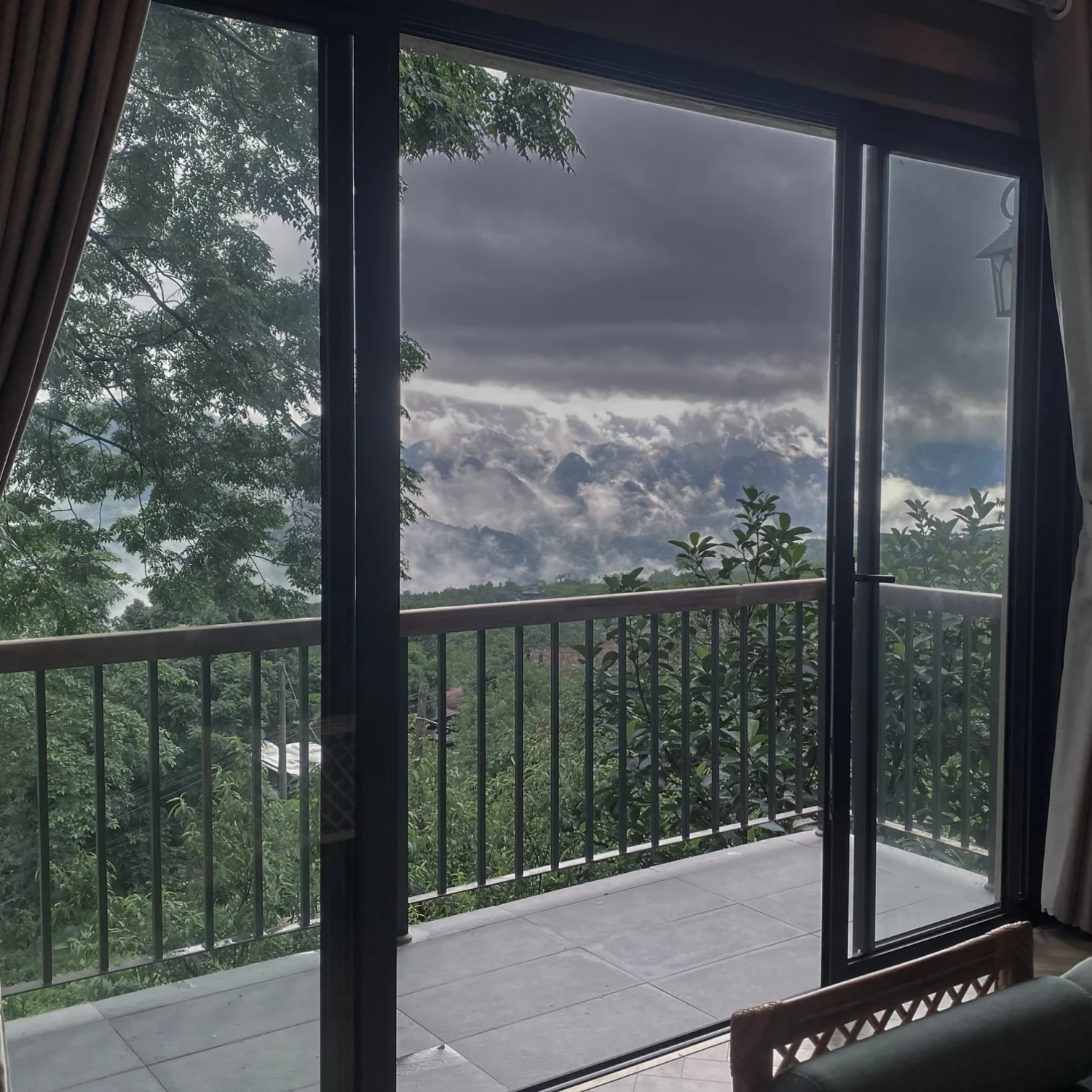 A quiet path and lit window as evening settles in Northern Vietnam.